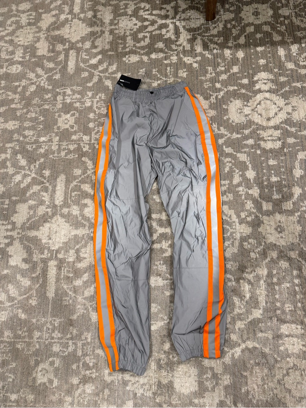 NWT Fashion Nova Women’s Gray Swishy Track Pants with Orange Side Stripes